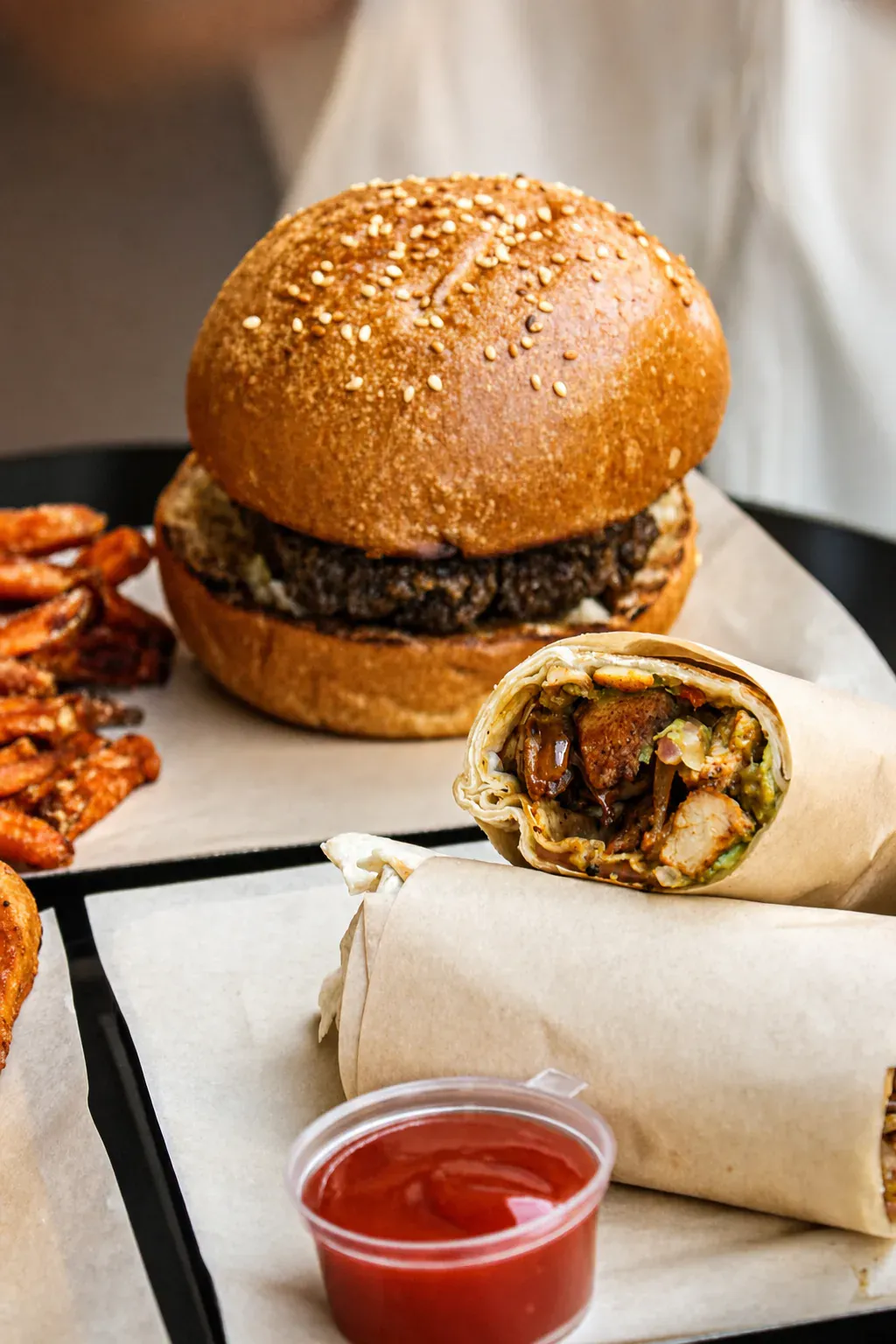 Close-up of a flame-grilled kosher burger · King David Burger Athens